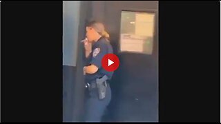 NYC Cop taking a smoke break. But what is she smoking? That is not a cigarette.