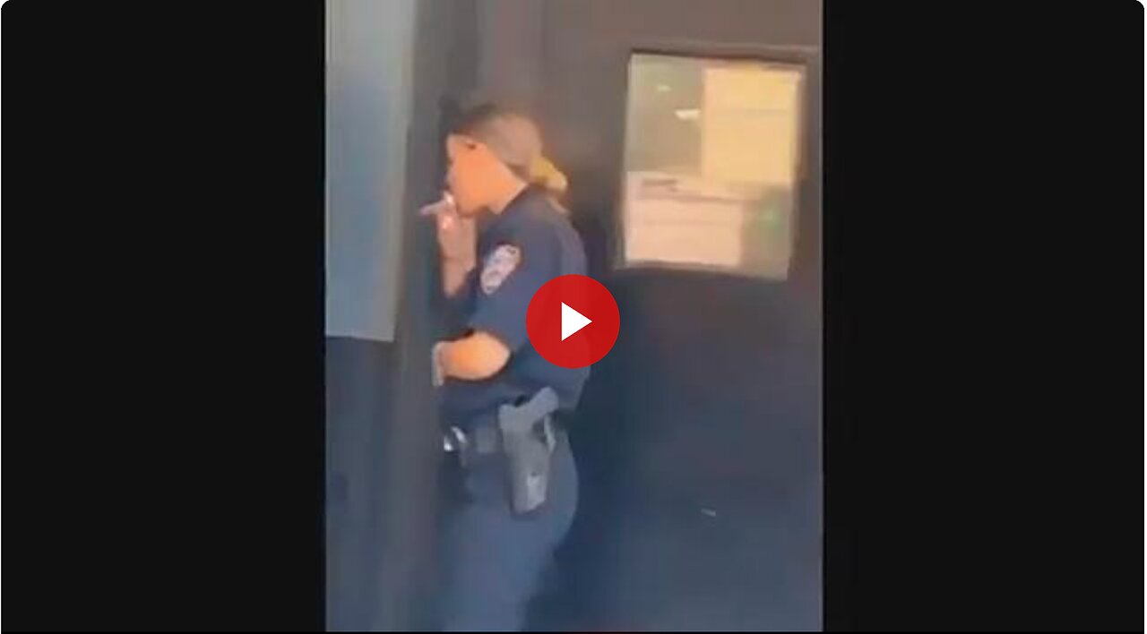 NYC Cop taking a smoke break. But what is she smoking? That is not a cigarette.