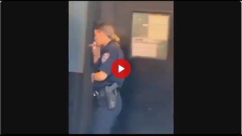 NYC Cop taking a smoke break. But what is she smoking? That is not a cigarette.