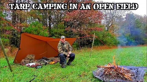 TARP CAMPING IN AN OPEN FIELD