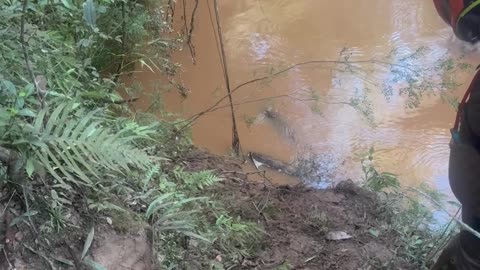 Man Flips Over Bike Trying to Drive Through Creek