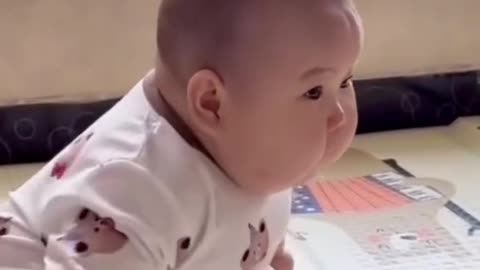 A cute baby is playing