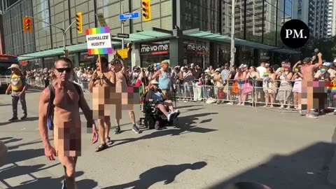 Nudists participate in the Toronto Pride Parade