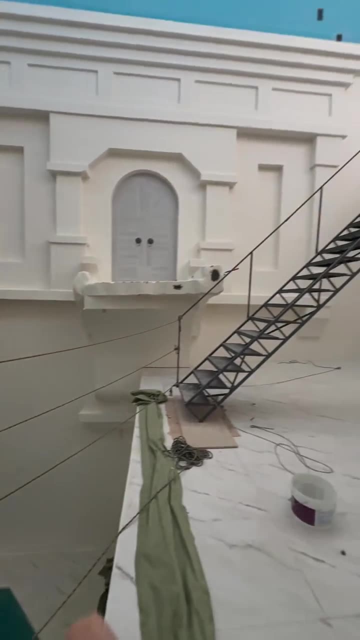 A very deep indoor pool with multiple levels emptied for maintenance