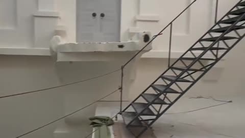 A very deep indoor pool with multiple levels emptied for maintenance