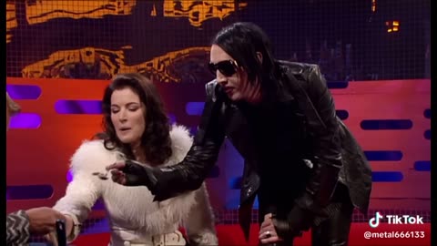 Marilyn Manson trying a cake