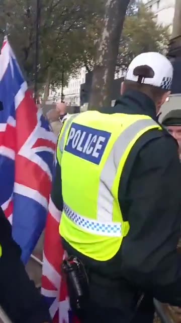 BRITISH POLICE CAUTION VETERANS FOR WAVING BRITISH FLAG