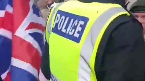 BRITISH POLICE CAUTION VETERANS FOR WAVING BRITISH FLAG