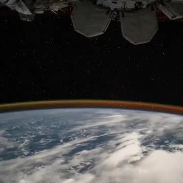 A night flight over the moonlit Earth in the International Space Station.