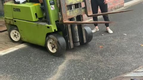 Driving Forklift Up a Trailer Ramp