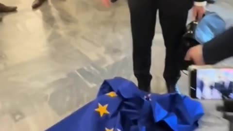 Polish politician Grzegorz Braun tore down, wiped his shoes with, and burned the EU flag.