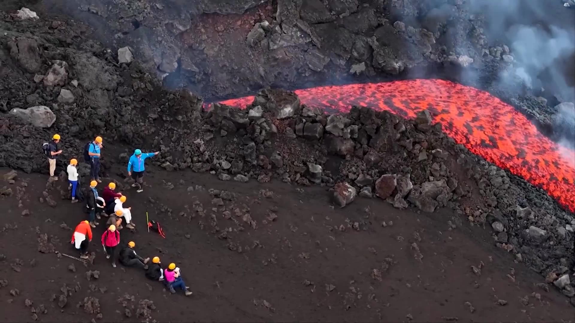 Drone footage shows Mount Etnas red lava flowing