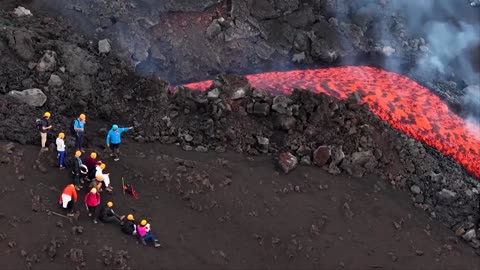 Drone footage shows Mount Etna's red lava flowing