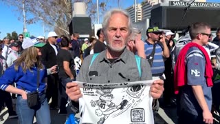 Activists distribute ‘ICE OUT’ towels at the Super Bowl