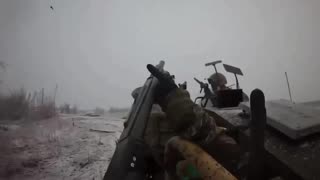 Ukrainian soldiers repel an attack by a Russian FPV drone.