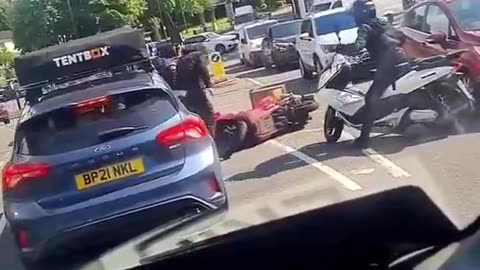 Usual suspects wanted to steal his motorbike in broad daylight. In UK no one is safe.