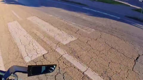 Motorcyclist Screams To The Beat As Car Enters Roundabout