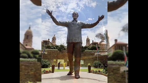 Nelson Mandela Statue Has A Rabbit In His Ear.