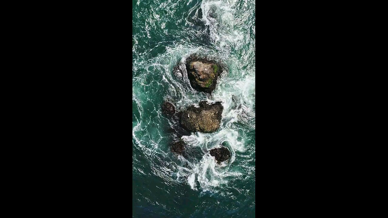 Birds Eye View of Crashing Waves on the Rock