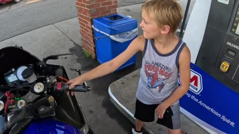 Motorcyclist Lets Kid Rev His Engine