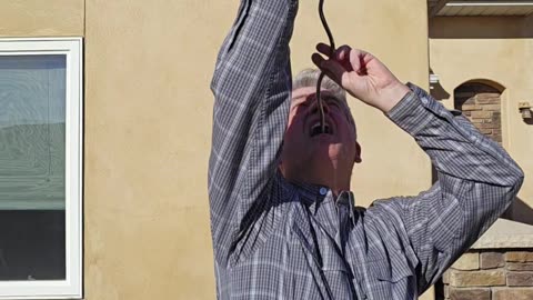 Brad Byers Swallowing a Giant Corkscrew