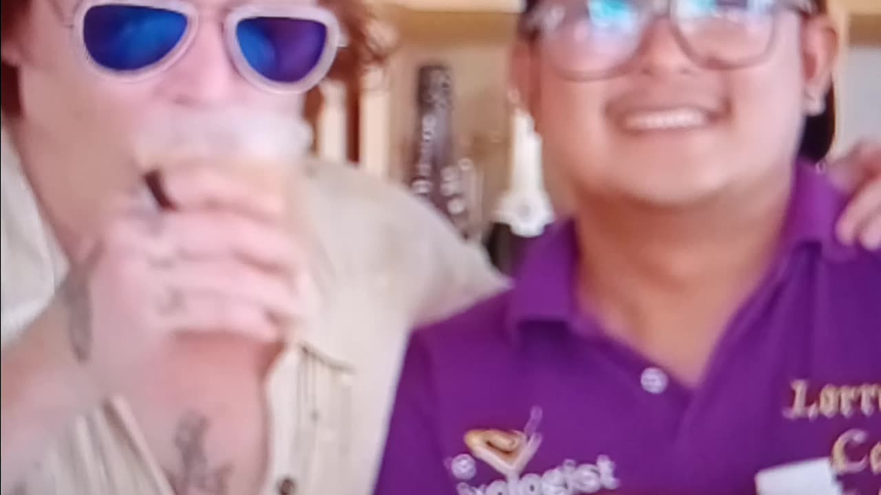 Johnny Depp signs poster at Cafe