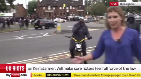 A gang of Muslim thugs approach a Sky News team