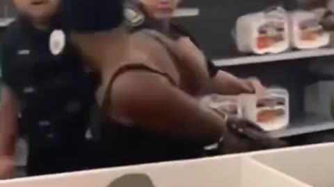 negro sheboon bites officer and gets SLAMMED