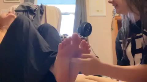 Friends tickling each-other feet