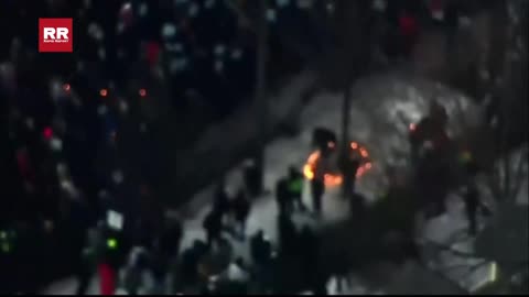 Aerial footage shows protesters at the scene of the ICE-involved shooting in Minneapolis.