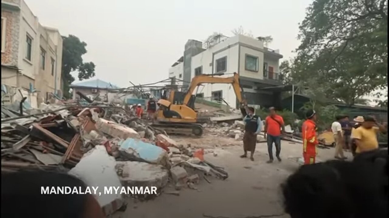 Rescuers search through rubble of collapsed buildings after earthquake in Myanmar