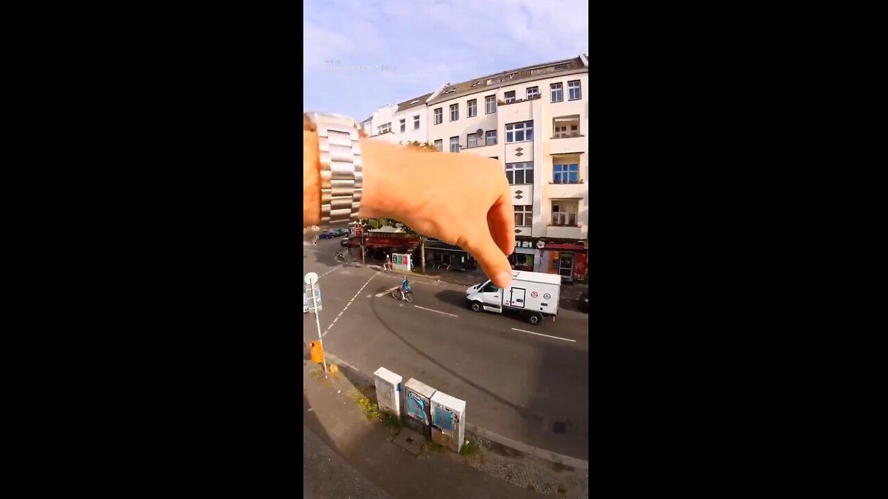 Erik Schmitt’s giant hand is controlling traffic - LOL