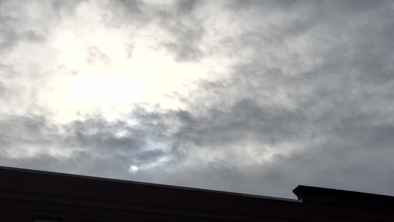 White sun and yellow sun through the "clouds"