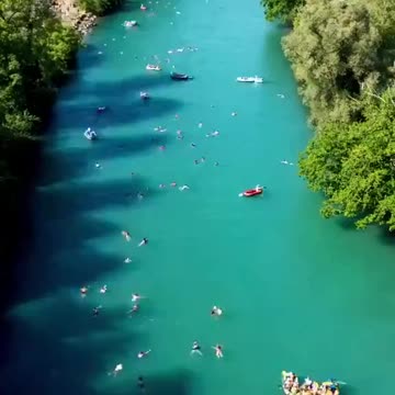 In Bern, Switzerland, locals beat the summer heat by rafting and swimming home via the Aare River.