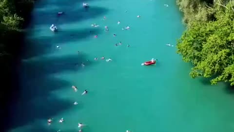 In Bern, Switzerland, locals beat the summer heat by rafting and swimming home via the Aare River.