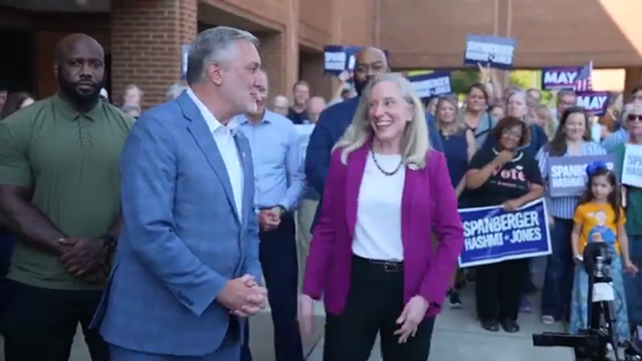 Democrat Spanberger and Republican Reid meet at polls on first day of early voting in Virginia