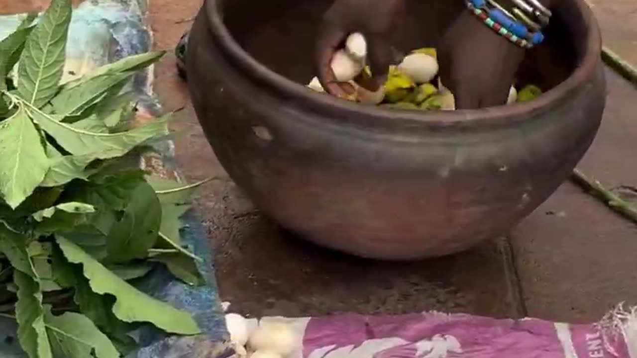Why is he putting a snake and so many fruits inside a calabash? Someone educate us please 🤔