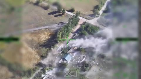 Ukrainian Drone Dropping Bombs Through Roof of Russian Outpost