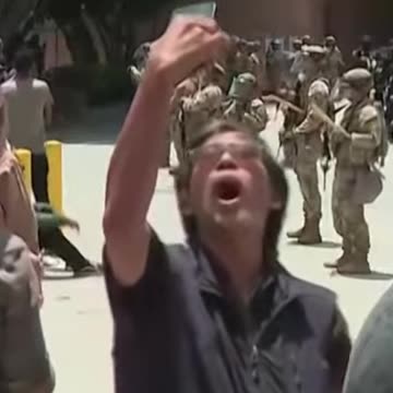 Disturbing Footage: Man Screams Extremist Chants at Riot