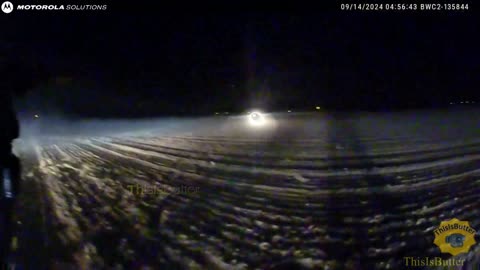 Suspect is shot at when she drove towards the direction of the officer in a dirt field