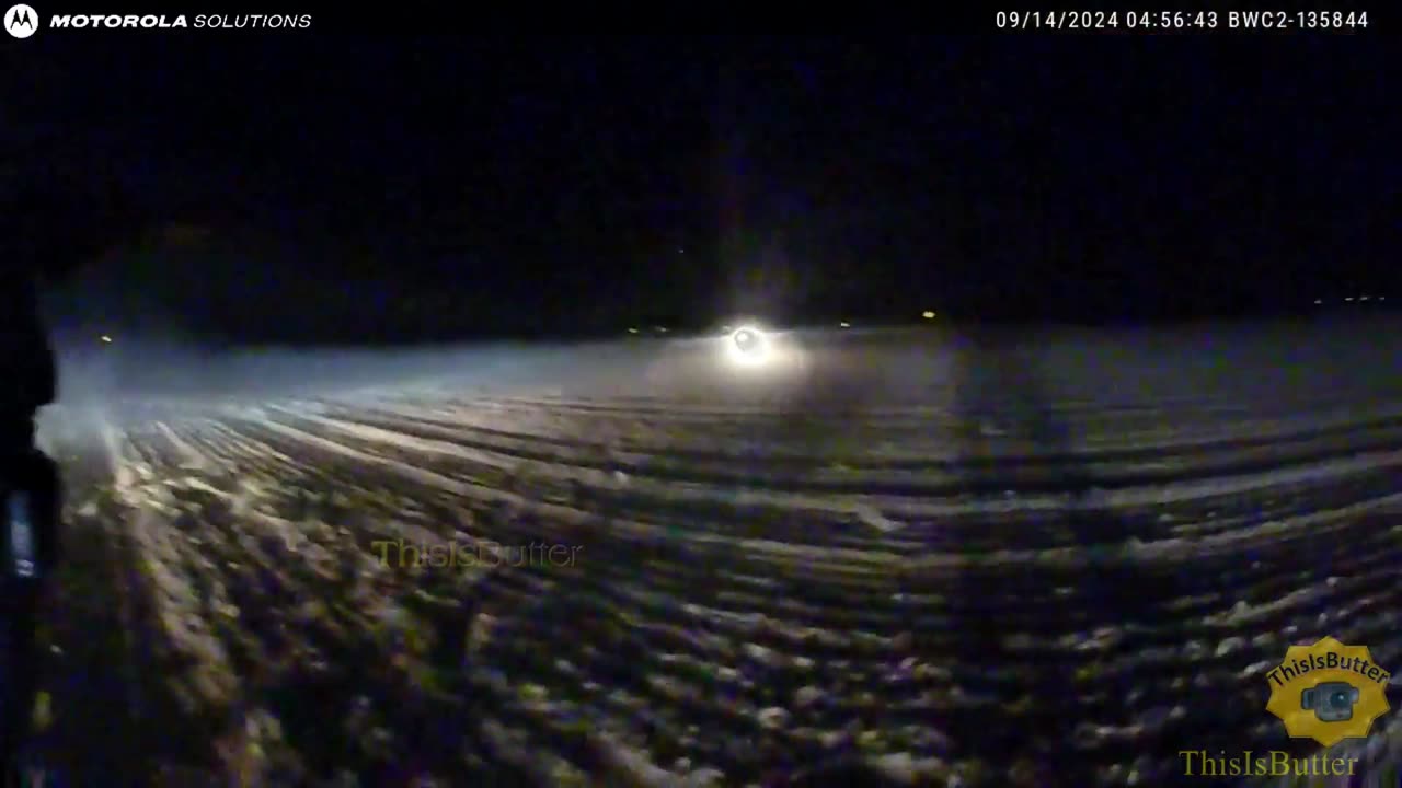 Suspect is shot at when she drove towards the direction of the officer in a dirt field