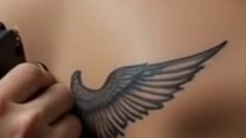 Stylish Girl Gets Feather Tattoo on Lower Back – Bold & Beautiful | A Gorgeous Tattoo on Her Back
