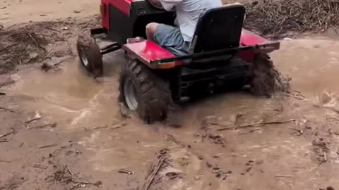 Kids driving mini tractor and playing with tractor