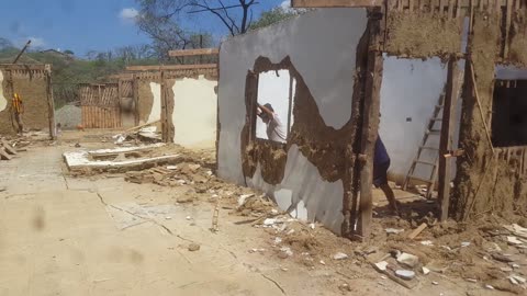 Construction Workers Dodge Falling Wall