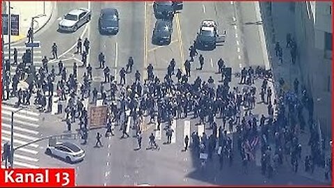 Aerial footage shows LA protest with ‘Trump must go now’ sign after National Guard deployment