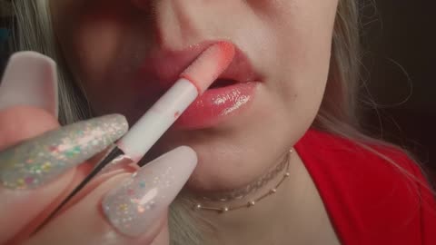 asmr unintelligible lip gloss applying