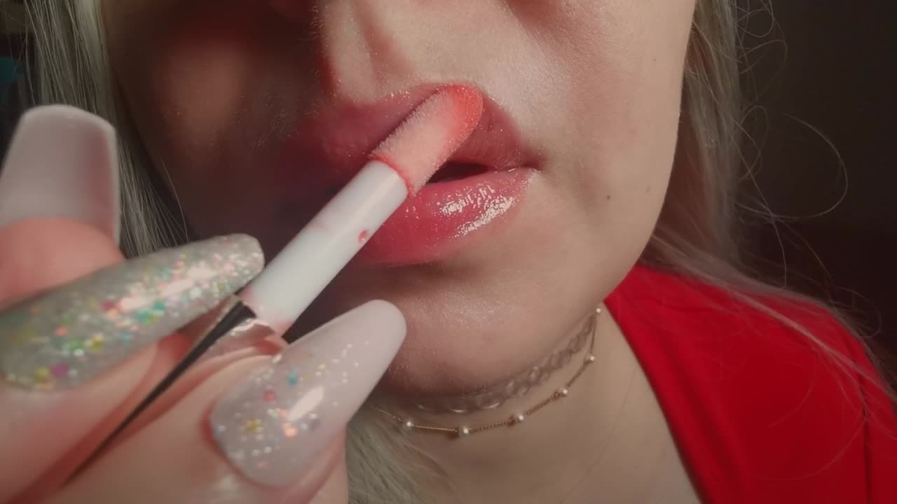 asmr unintelligible lip gloss applying