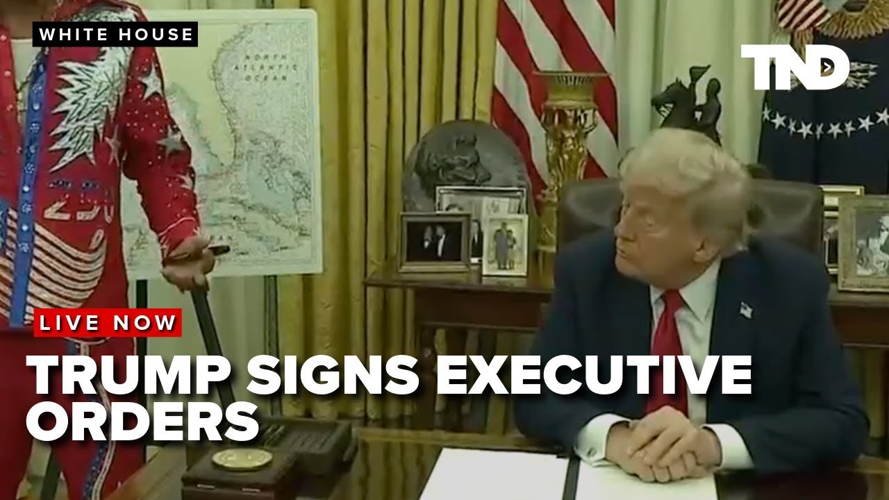 President Donald Trump signs executive orders in the White House from the Oval Office