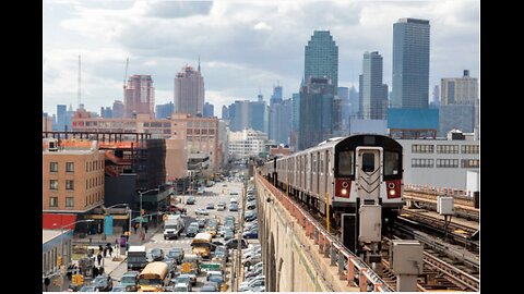 Subway Train Approaching Elevated Subway Station in Queens, New York - stock photo