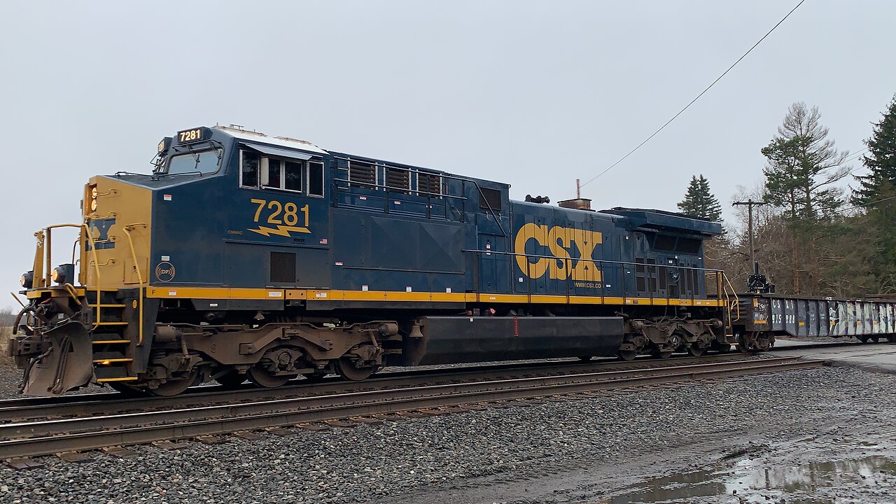 CSX Train Engine 7281 hauling rail maintenance equipment